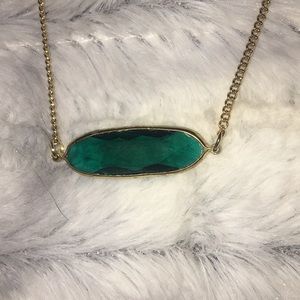 Necklace with emerald like stone